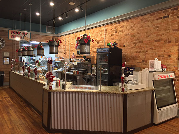 The rolled ice cream counter where the rolled ice cream magic happens on main street in Greenville!